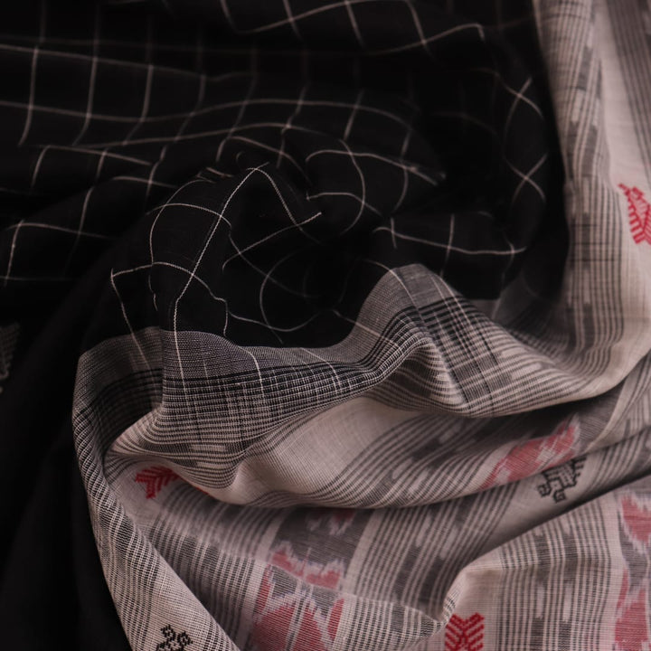 Full view of a Black and White Sambalpuri Cotton Saree with Butta pattern.
