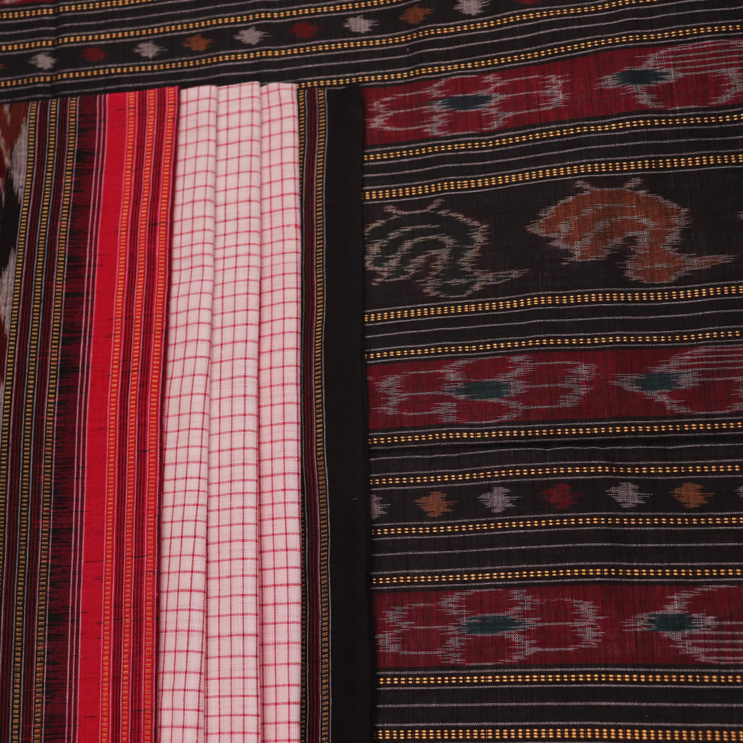 Woman draped in a white and black Sambalpuri cotton saree with motifs.