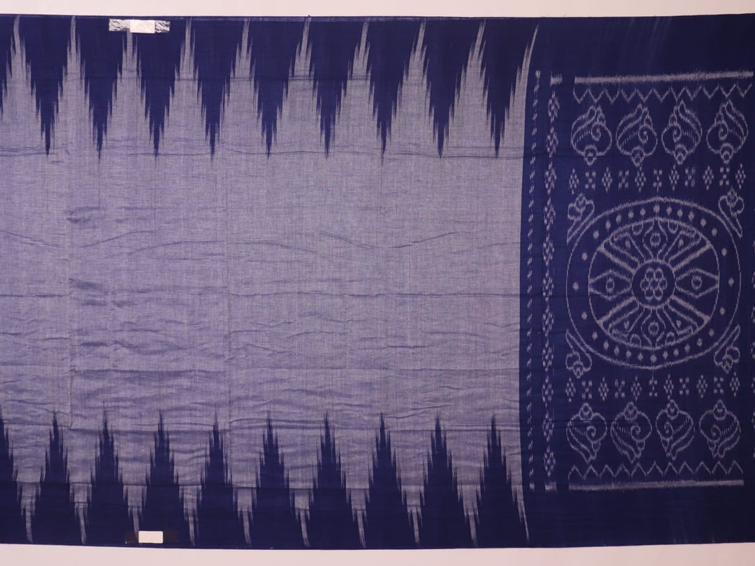 Blue plain Sambalpuri cotton saree styled, highlighting its simple elegance and drape.
