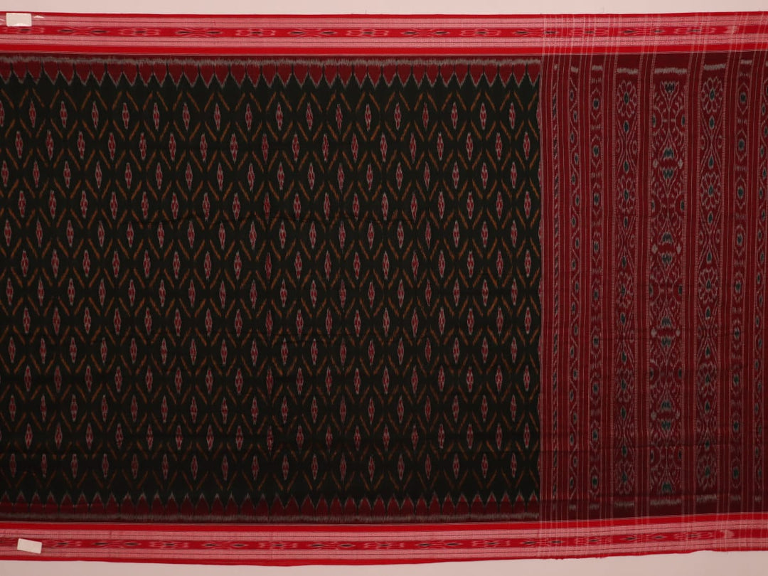 Black and red Sambalpuri cotton saree draped, showcasing its traditional motifs and elegant handloom texture.