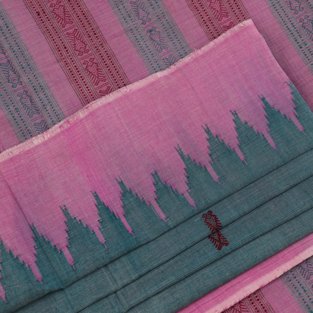 Full view of a plain handloom Sambalpuri cotton saree in green and peach.