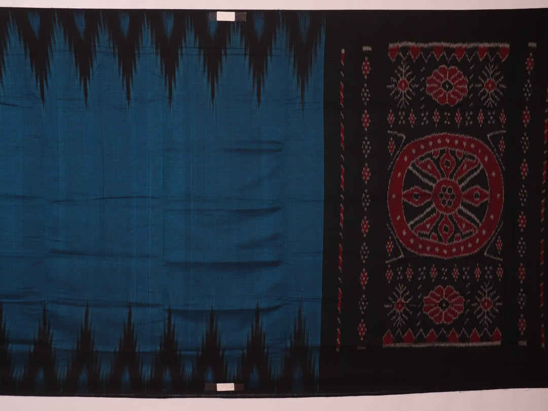 Draped plain blue and black Sambalpuri cotton saree.