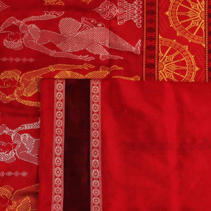 Close-up of Bomkai silk saree fabric texture in black and red, detailing the woven butta pattern.