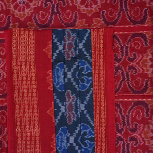 Full flat lay view of a blue and red Sambalpuri cotton saree showcasing the entire body and pallu design.