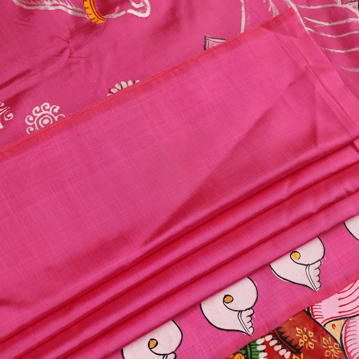 Close-up of pink silk Patachitra saree fabric, showcasing hand-painted texture and fine details.