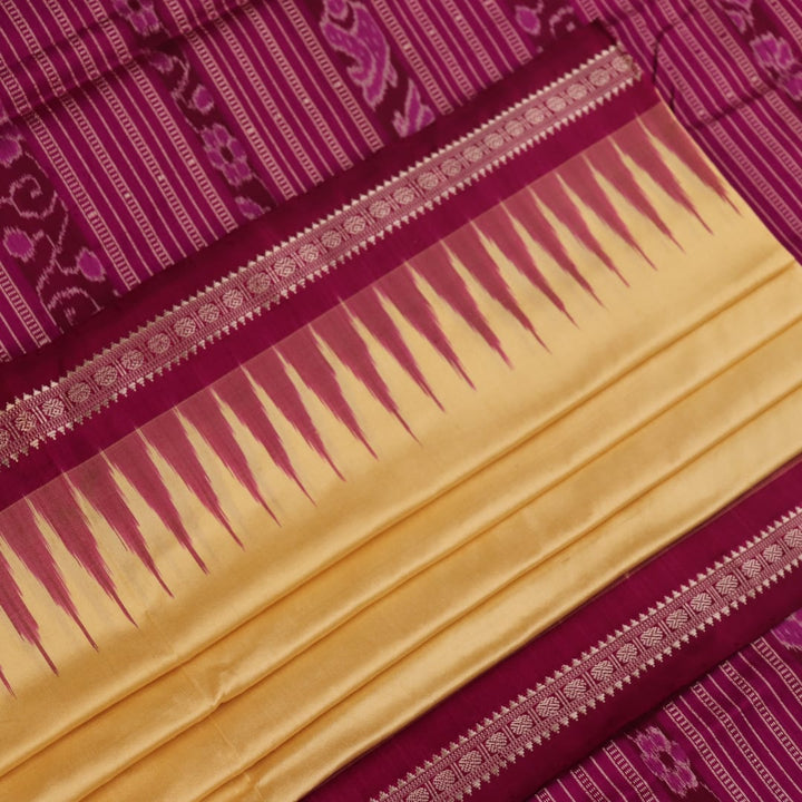 Close-up of plain cream and magenta Sambalpuri Silk Saree fabric texture.
