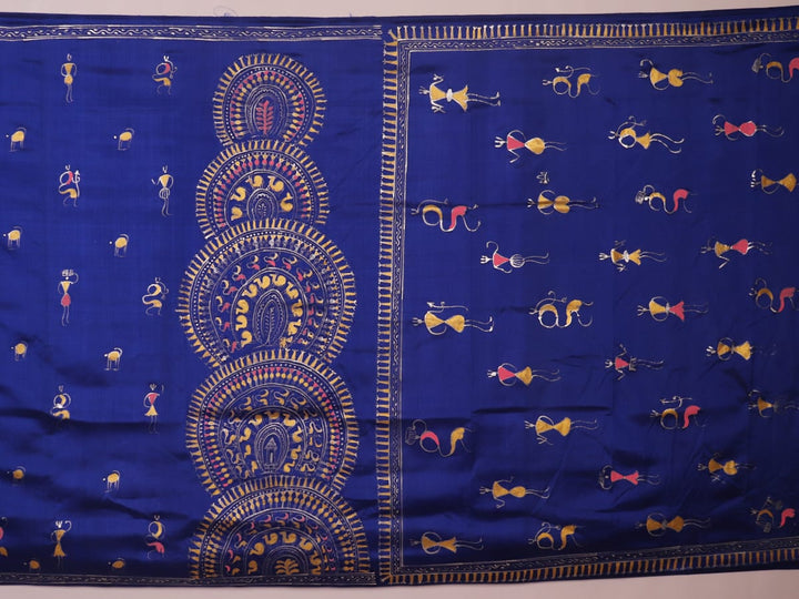 Close-up of handloom blue silk Patachitra saree, showcasing the detailed texture of the hand-painted fabric.