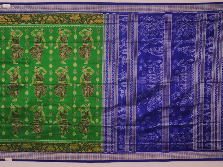 Close-up of green and blue Sambalpuri silk saree fabric showing intricate handloom weave and motif details.