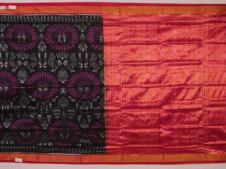 Close-up of black Sambalpuri silk saree fabric texture with subtle motifs and magenta threads.