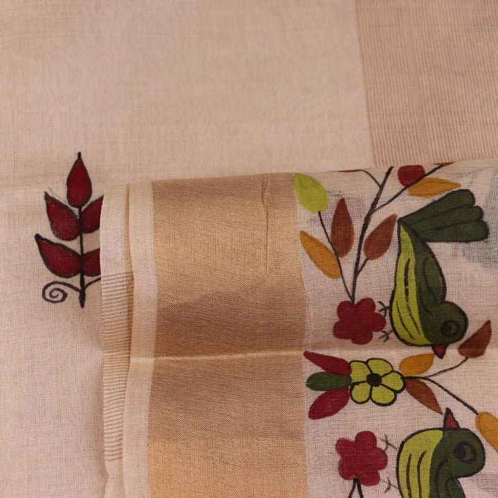 Close-up of off-white printed Tussar Silk saree fabric texture.