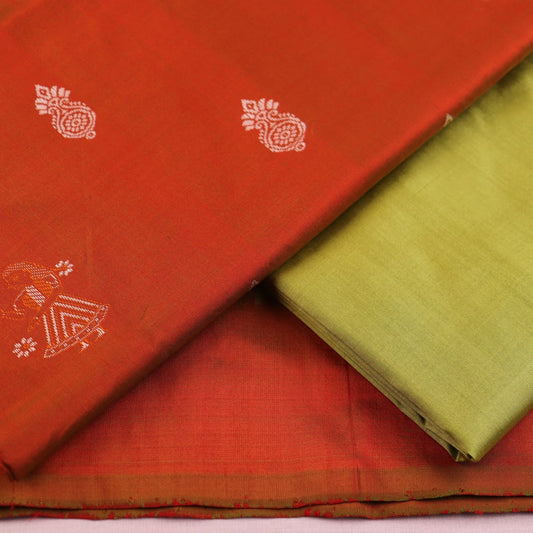 Detail of rust and green Bomkai silk blouse piece with butta pattern.