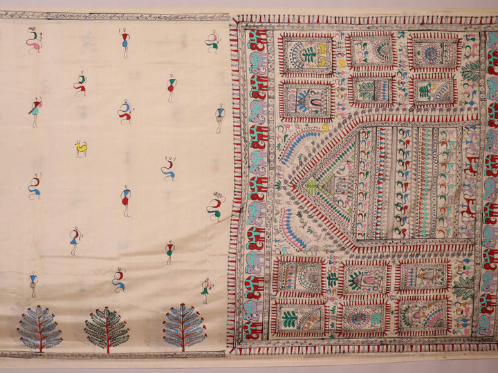 Close-up of the white silk saree fabric texture, showcasing the handloom weave and painted Patachitra details.