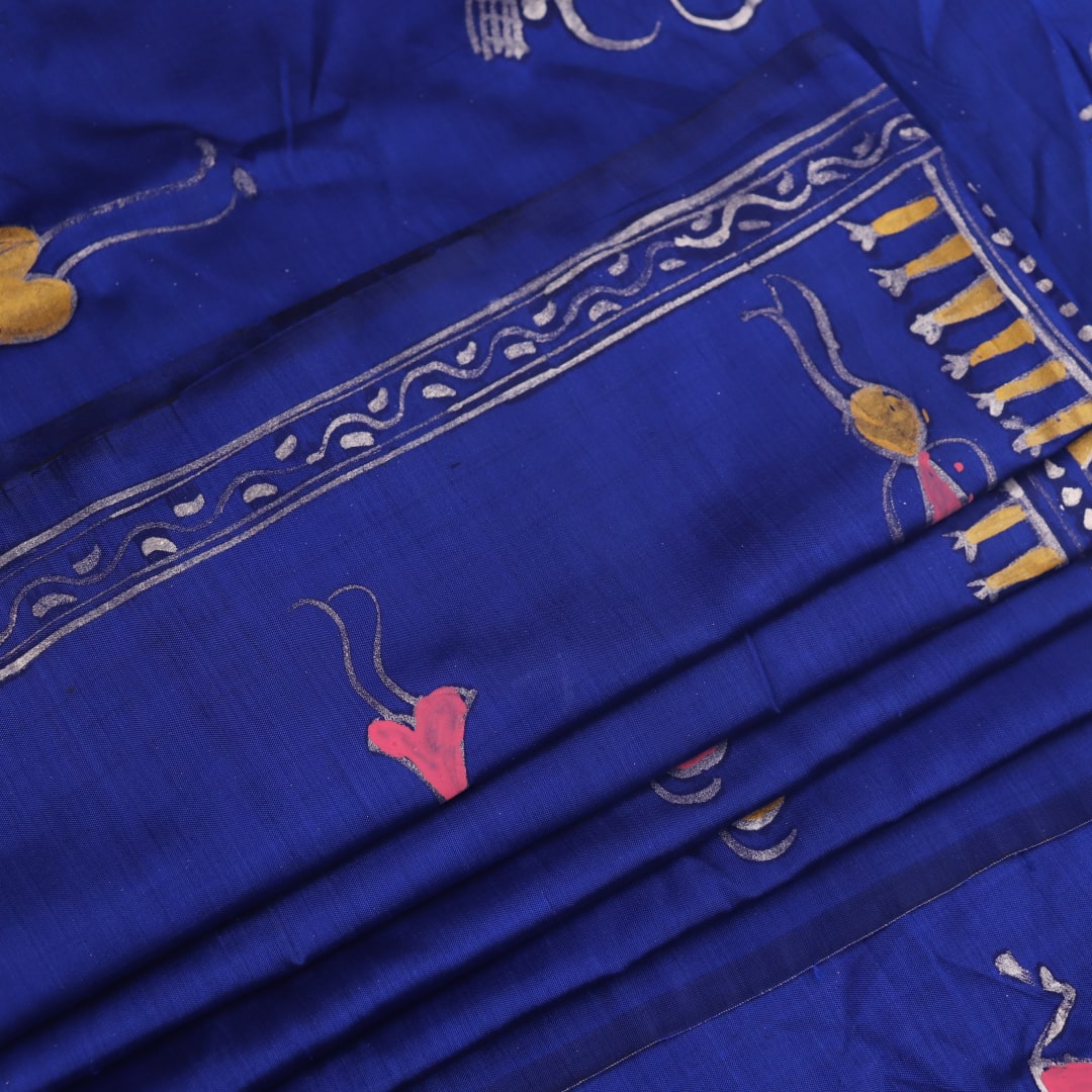 Close-up of handloom blue silk Patachitra saree, showcasing the detailed texture of the hand-painted fabric.