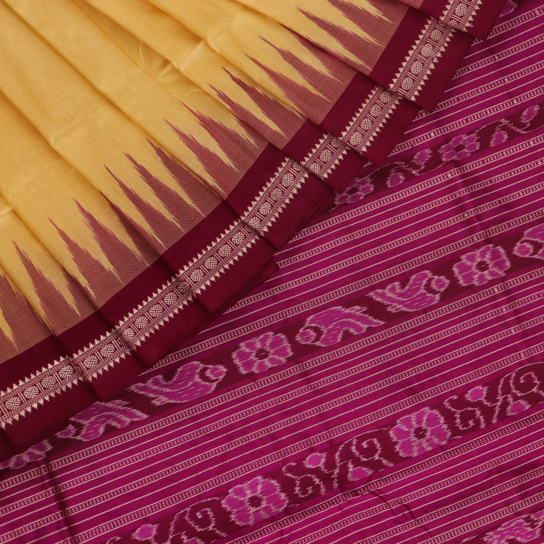 Close-up of plain cream and magenta Sambalpuri Silk Saree fabric texture.