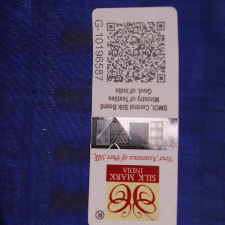 Close-up of handloom blue silk Patachitra saree, showcasing the detailed texture of the hand-painted fabric.