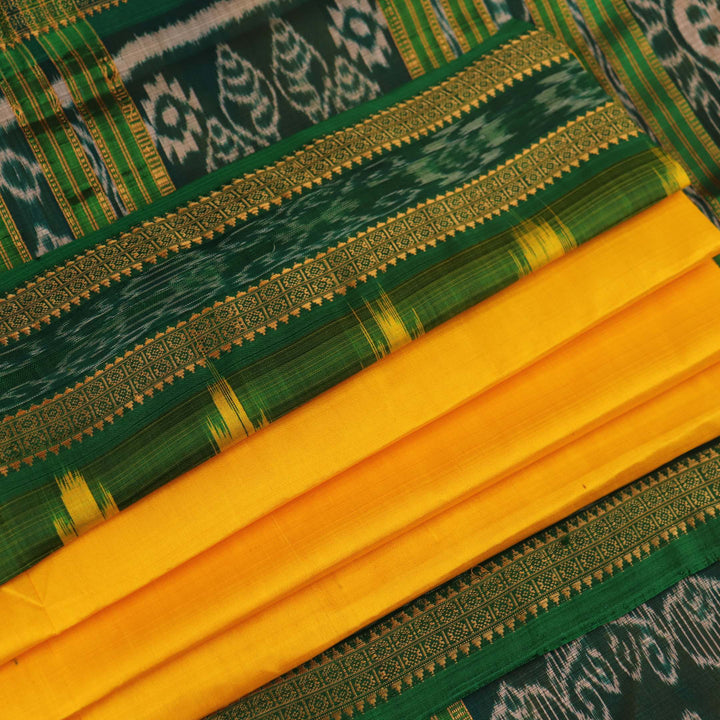 Yellow Khandua silk saree draped, showcasing its simple elegance and the plain body.
