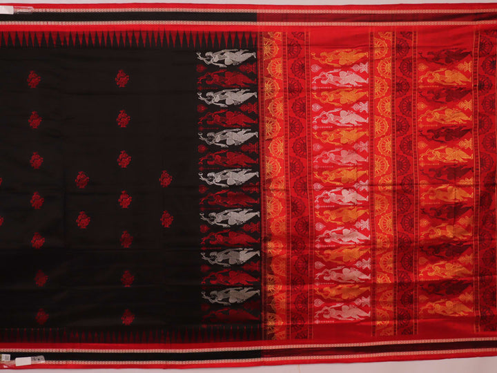 Close-up of Bomkai silk saree fabric texture in black and red, detailing the woven butta pattern.