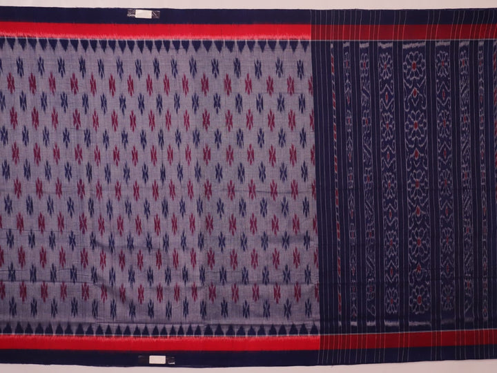 Blue Sambalpuri cotton saree with motifs, gracefully draped.