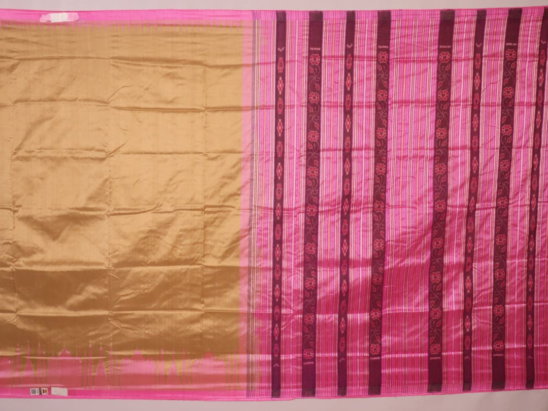 Close-up of green and pink plain Sambalpuri silk saree fabric texture.