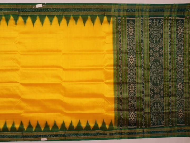 Yellow Khandua silk saree draped, showcasing its simple elegance and the plain body.