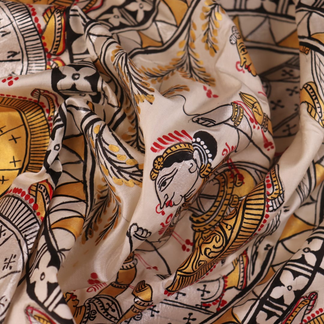 Close-up of white silk Patachitra saree, showcasing the handloom fabric's texture and subtle paint details.