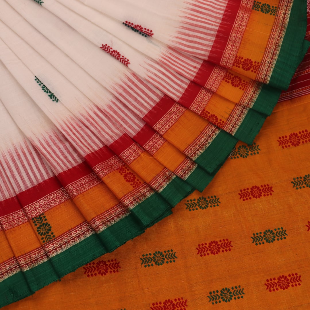 Full view of a white and green cotton handloom Bomkai saree with butta pattern.