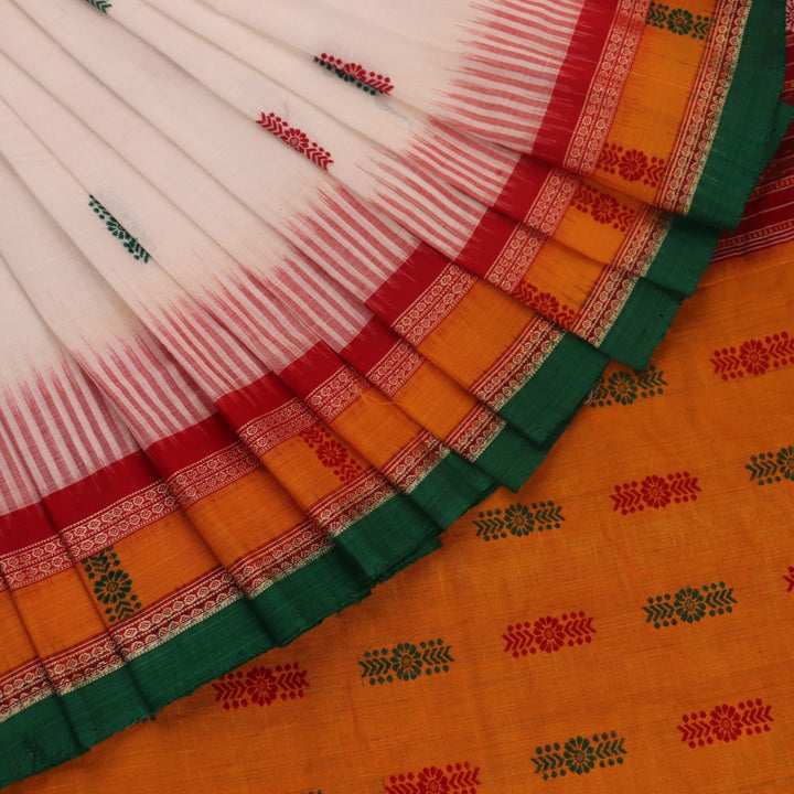 Full view of a white and green cotton handloom Bomkai saree with butta pattern.