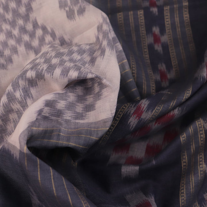 Draped view of white and grey Sambalpuri cotton saree with motifs.