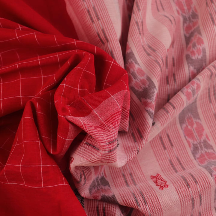 Full view of a red and white Sambalpuri cotton saree with all-over butta pattern.