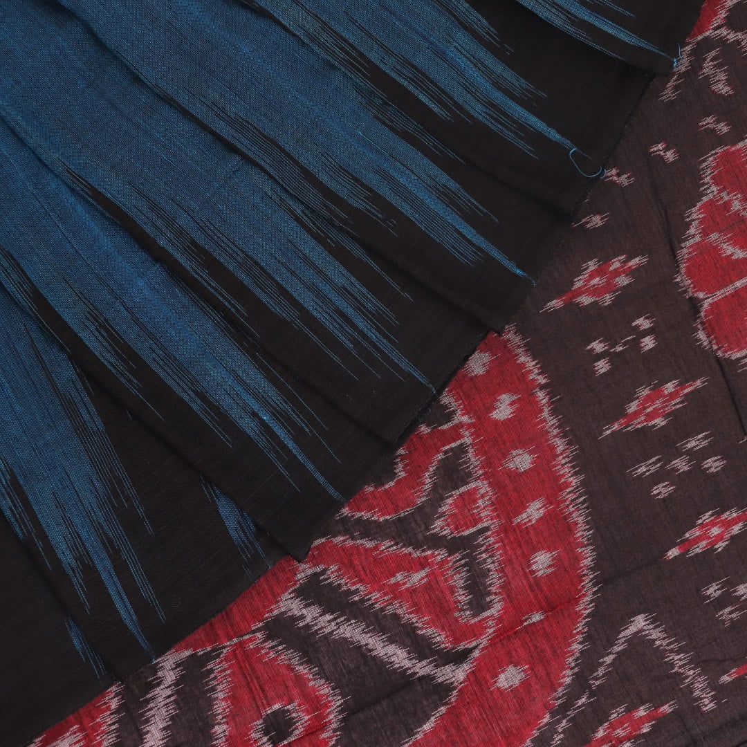 Draped plain blue and black Sambalpuri cotton saree.