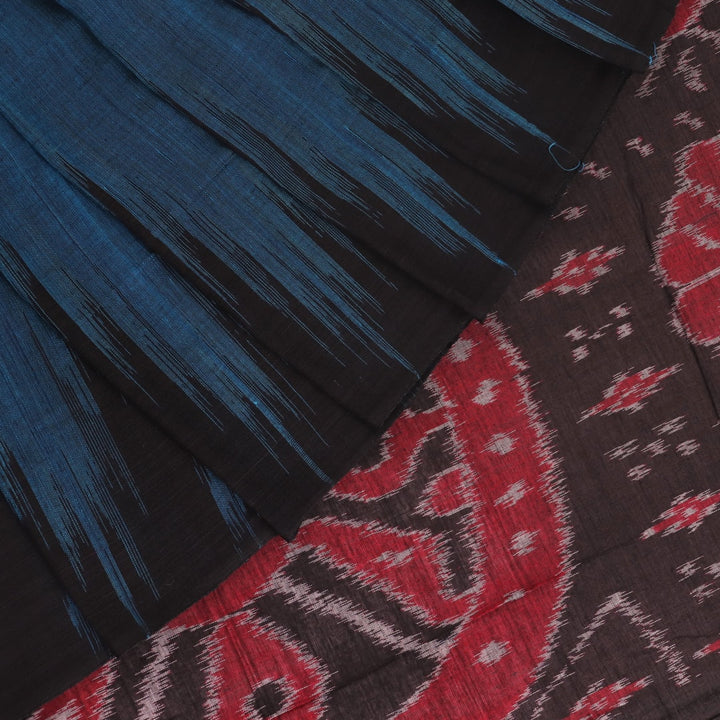 Draped plain blue and black Sambalpuri cotton saree.