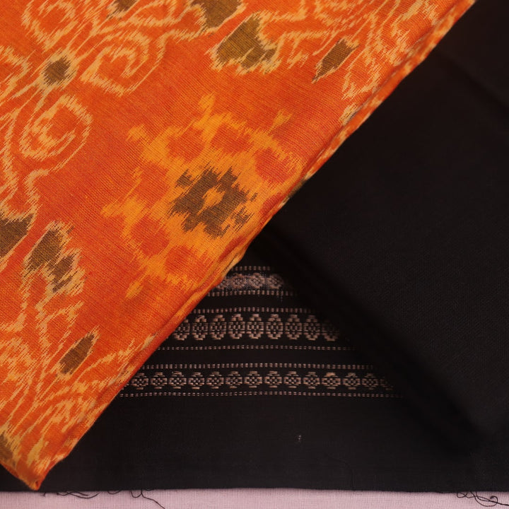 Blouse piece of yellow and black Sambalpuri cotton dress material with motifs.