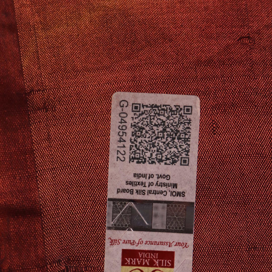 Close-up showing the textured weave of a yellow and brown printed Tussar silk saree.