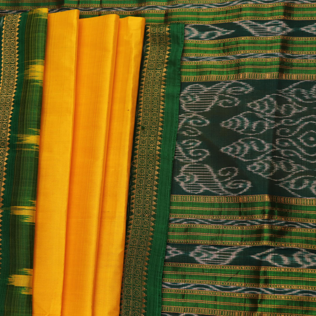 Yellow Khandua silk saree draped, showcasing its simple elegance and the plain body.