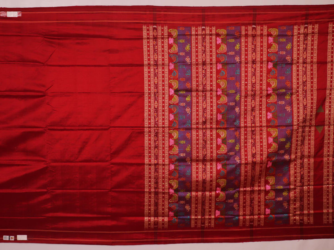 Close-up of maroon plain Sambalpuri silk saree fabric texture.