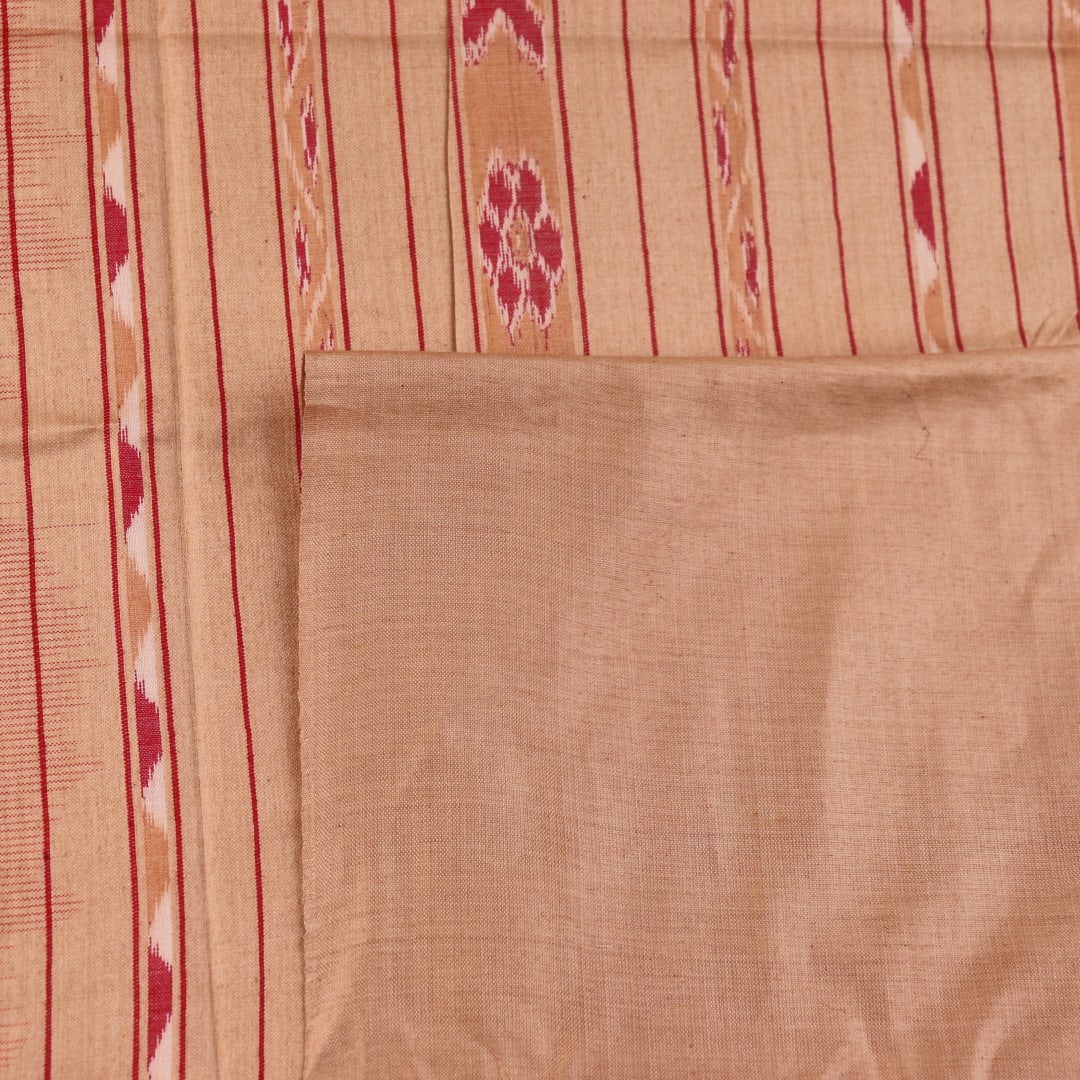 Close-up of plain red and off-white Tussar silk saree fabric texture.