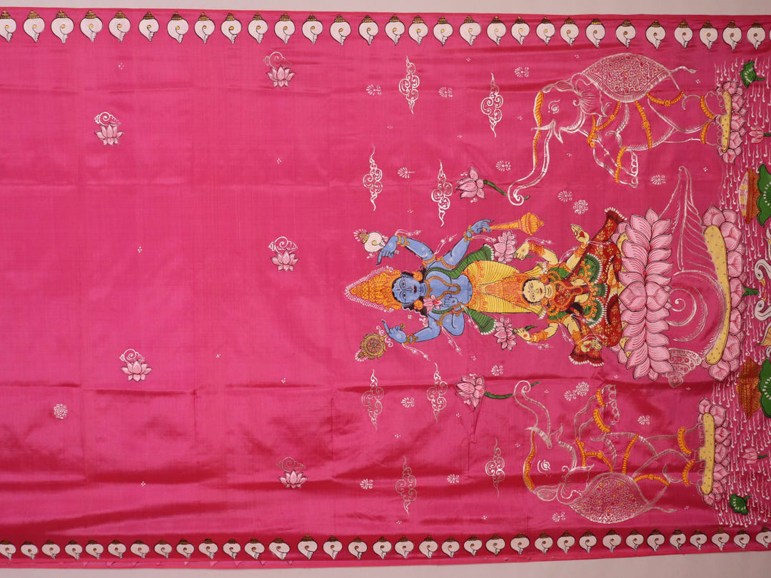 Close-up of pink silk Patachitra saree fabric, showcasing hand-painted texture and fine details.