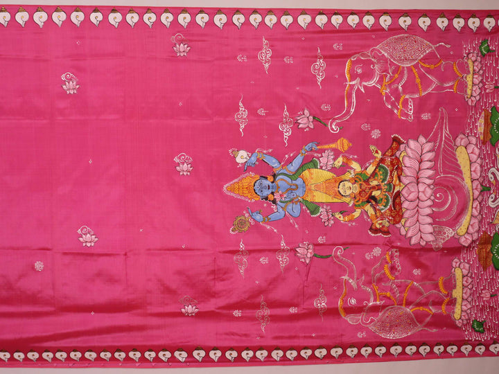 Close-up of pink silk Patachitra saree fabric, showcasing hand-painted texture and fine details.