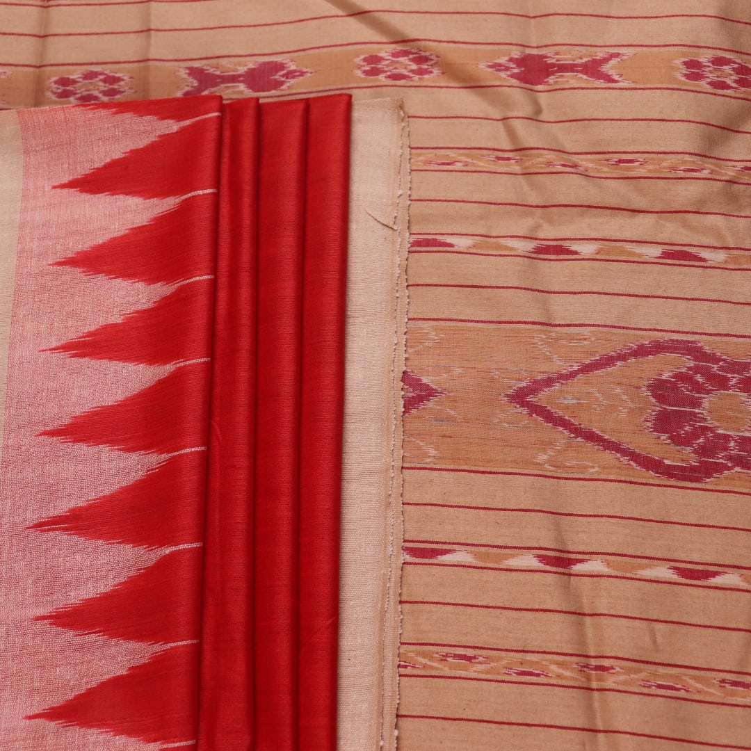 Close-up of plain red and off-white Tussar silk saree fabric texture.