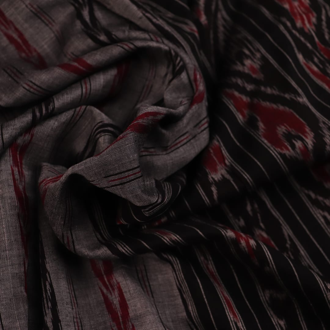 Grey and black Sambalpuri cotton saree draped, showcasing overall look and handloom texture.