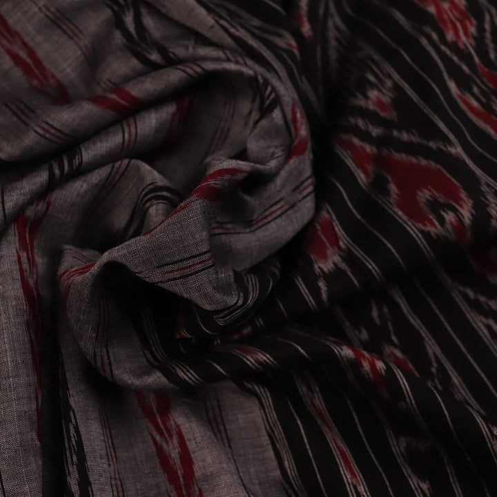 Grey and black Sambalpuri cotton saree draped, showcasing overall look and handloom texture.