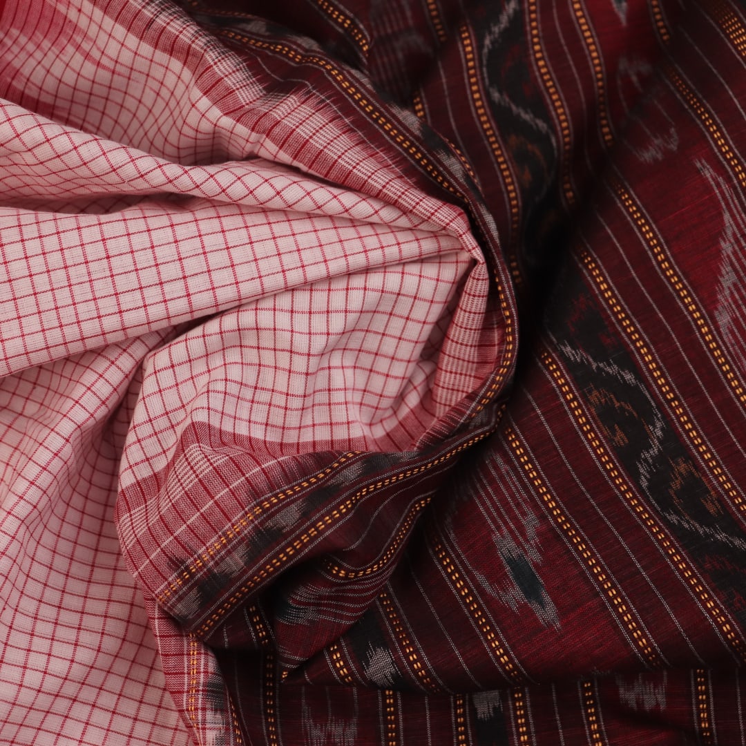 Saree styling: White and black Sambalpuri cotton saree with motifs, draped to showcase the overall look.