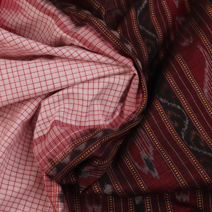 Saree styling: White and black Sambalpuri cotton saree with motifs, draped to showcase the overall look.