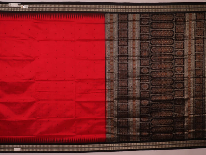 Detailed close-up of the red and black Bomkai silk saree fabric texture, featuring a butta pattern.