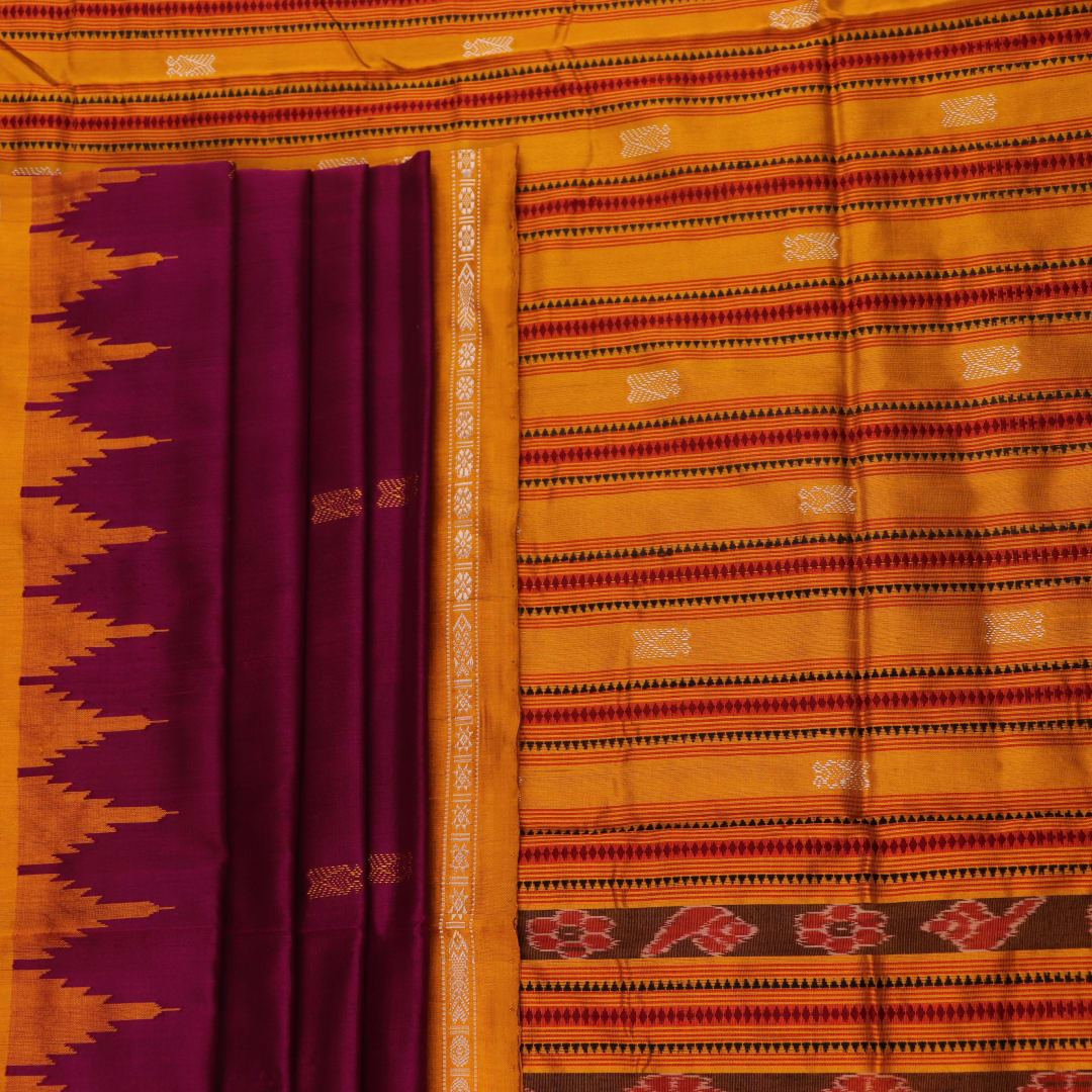 Close-up fabric texture of a magenta Sambalpuri Silk Saree with yellow butta pattern.