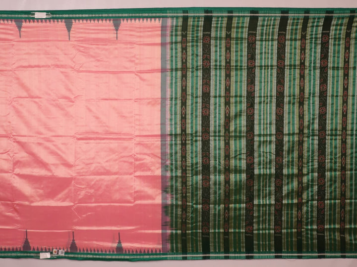 Close-up of the plain woven silk texture of a pink and green Sambalpuri saree.