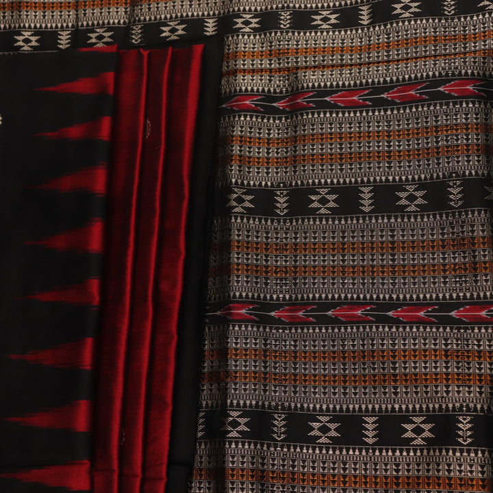 Close-up texture of handwoven Bomkai silk saree fabric: maroon and black threads forming butta pattern.