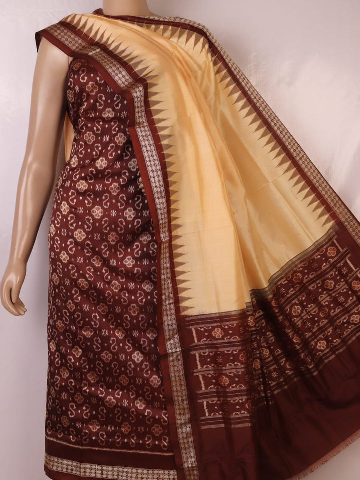 Detail of the brown and cream Sambalpuri silk dress material blouse piece with motifs.