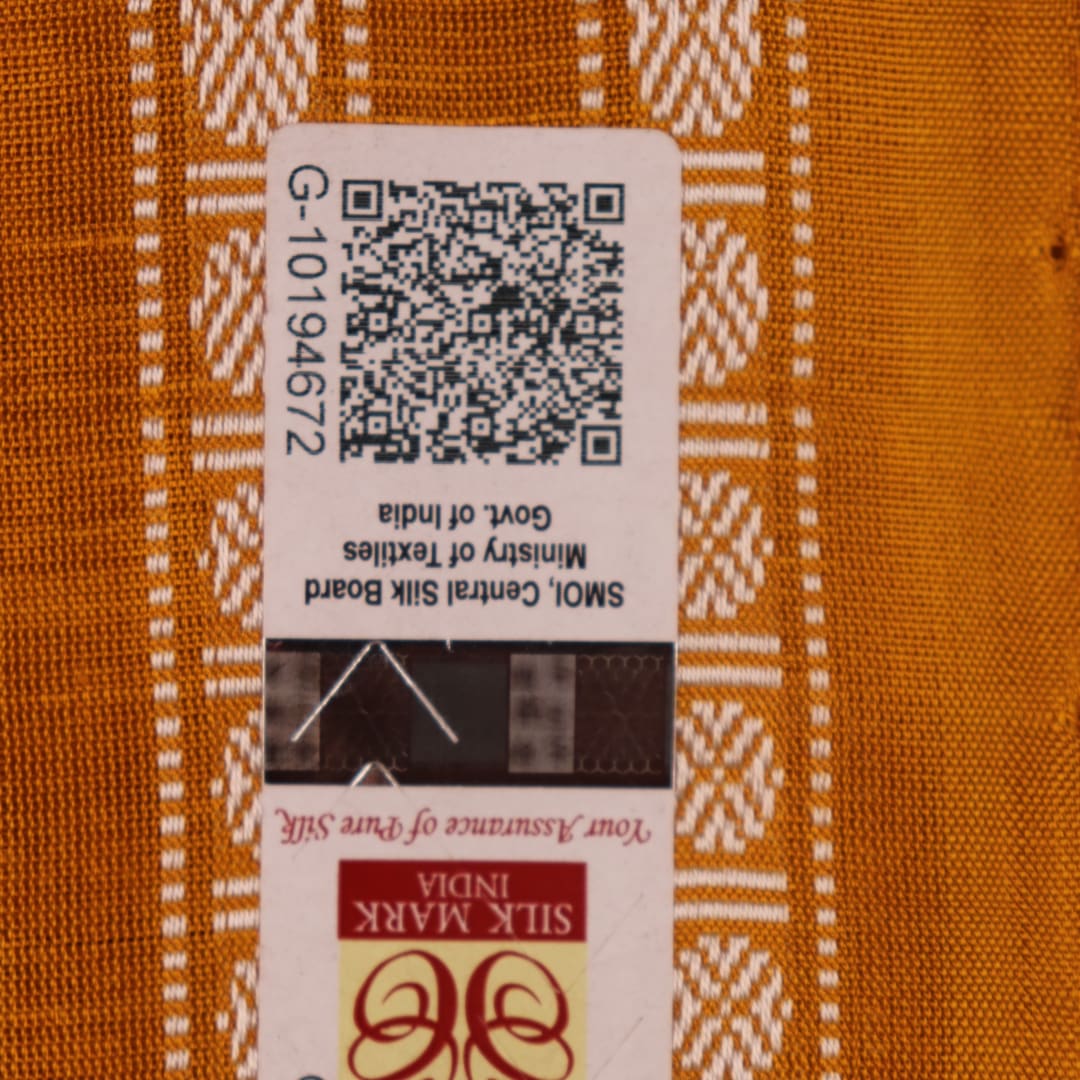 Close-up fabric texture of a magenta Sambalpuri Silk Saree with yellow butta pattern.