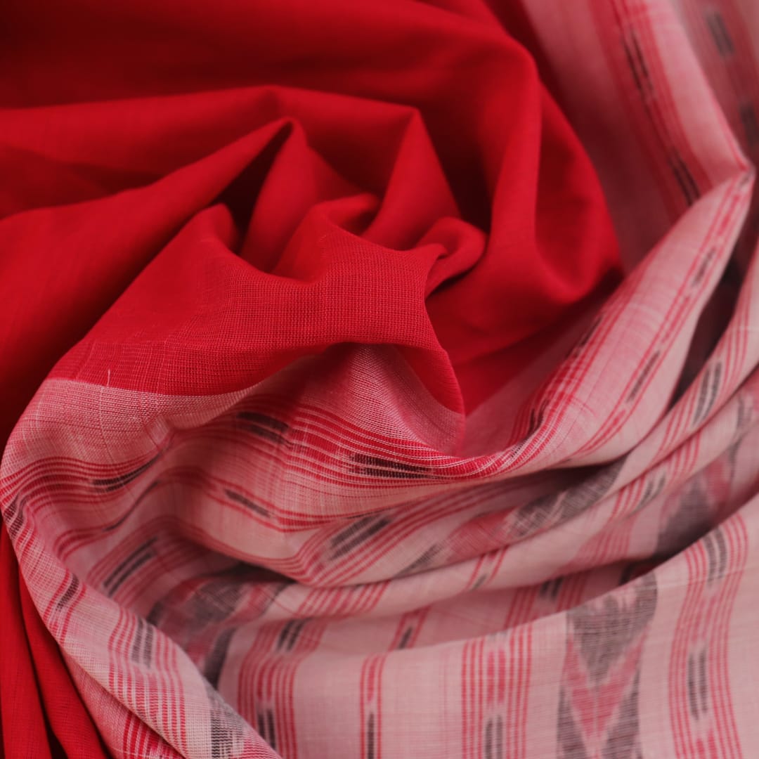 Full view of a plain red and white handloom Sambalpuri cotton saree.